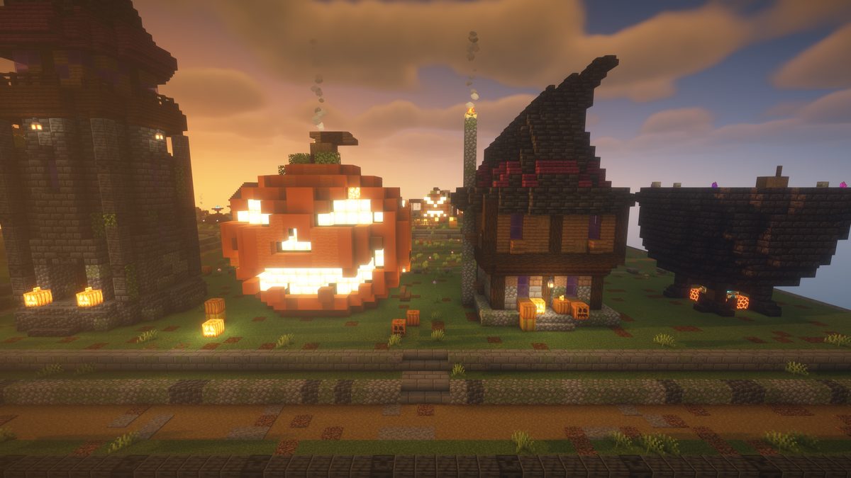 A giant jack o'lantern next to a witch hat house and a stone tower
